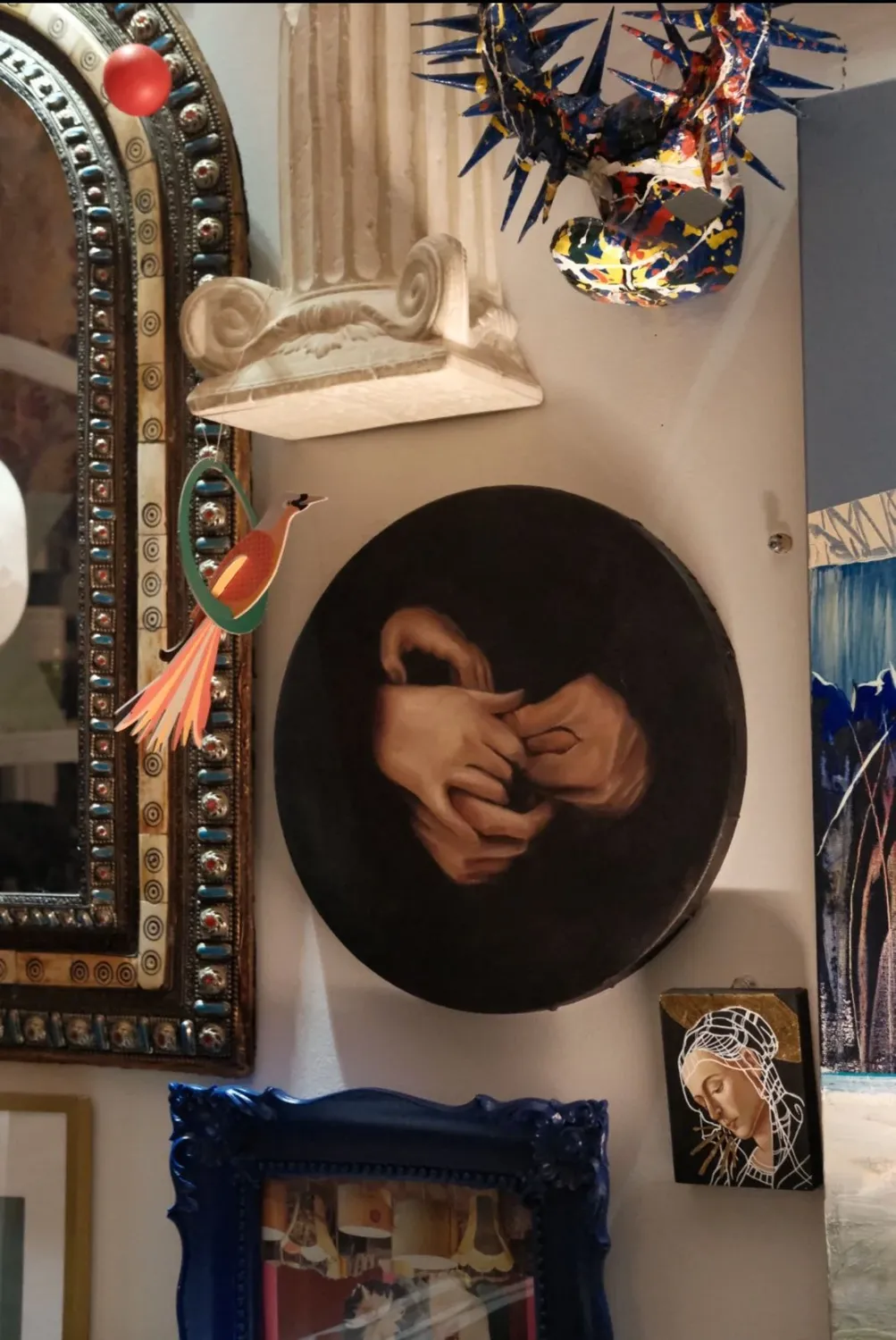 A pair of vintage hands sculpture displayed on a wall